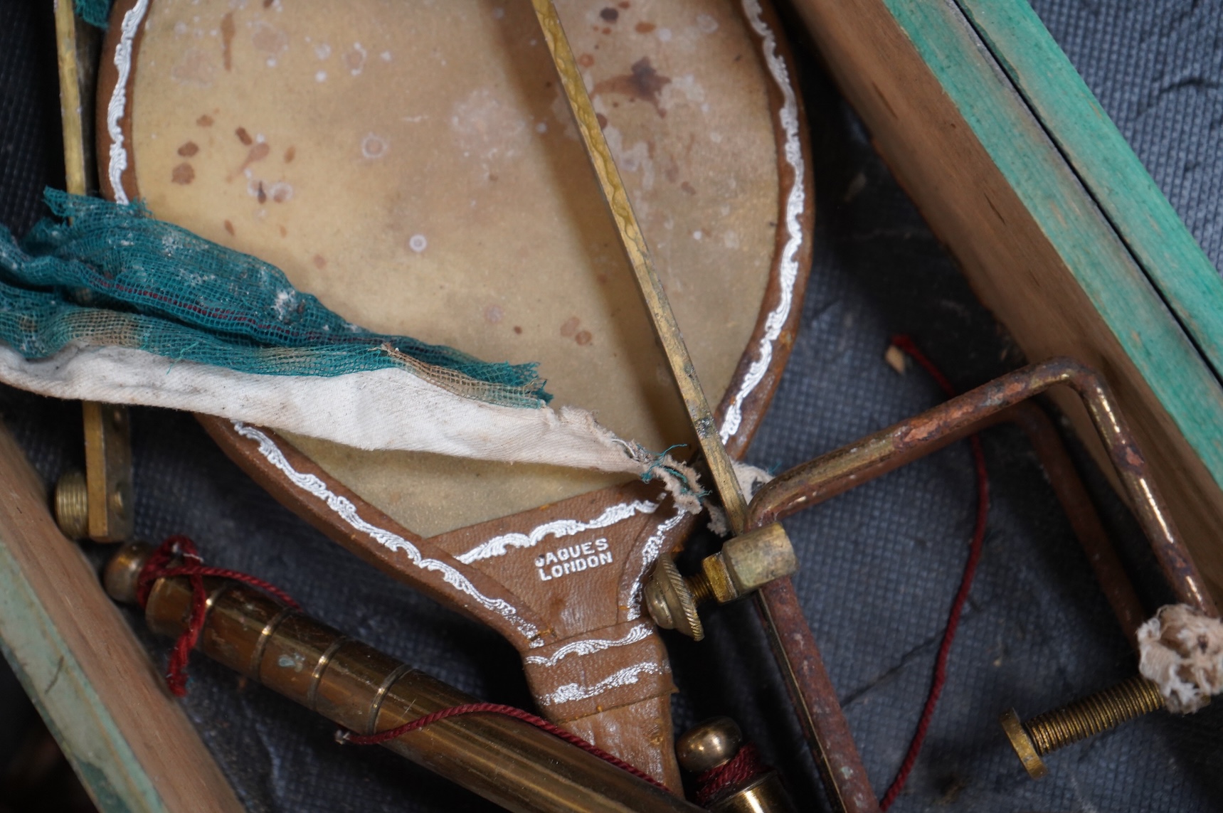 A collection of 19th century toys including; an early Jaques Ping Pong or Gossima set in an illustrated wooden case, a Crandall’s John Gilpin wooden horse with folded linen backed poster, ‘The Adventures of John Gilpin’